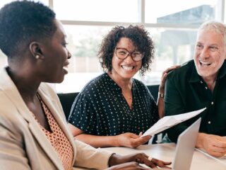 Professional Woman Laptop With Clients Gettyimages 1178856357 1200w 628h.jpg